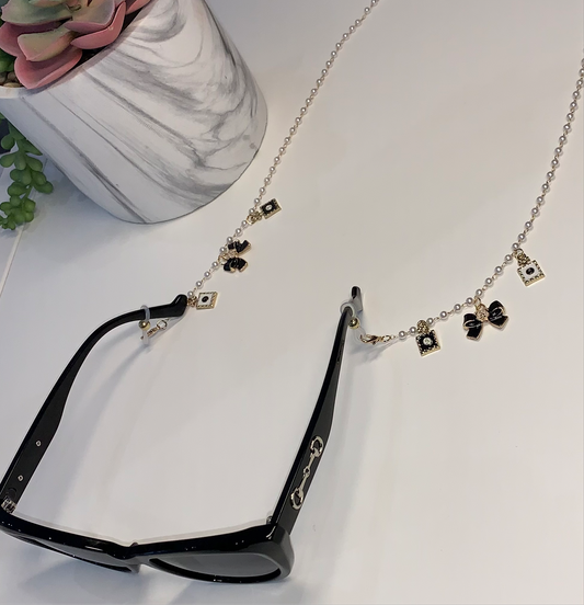 Gold and white bow sunglasses charm