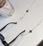 Gold clover sunglasses charm