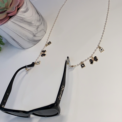 Gold and white bow sunglasses charm